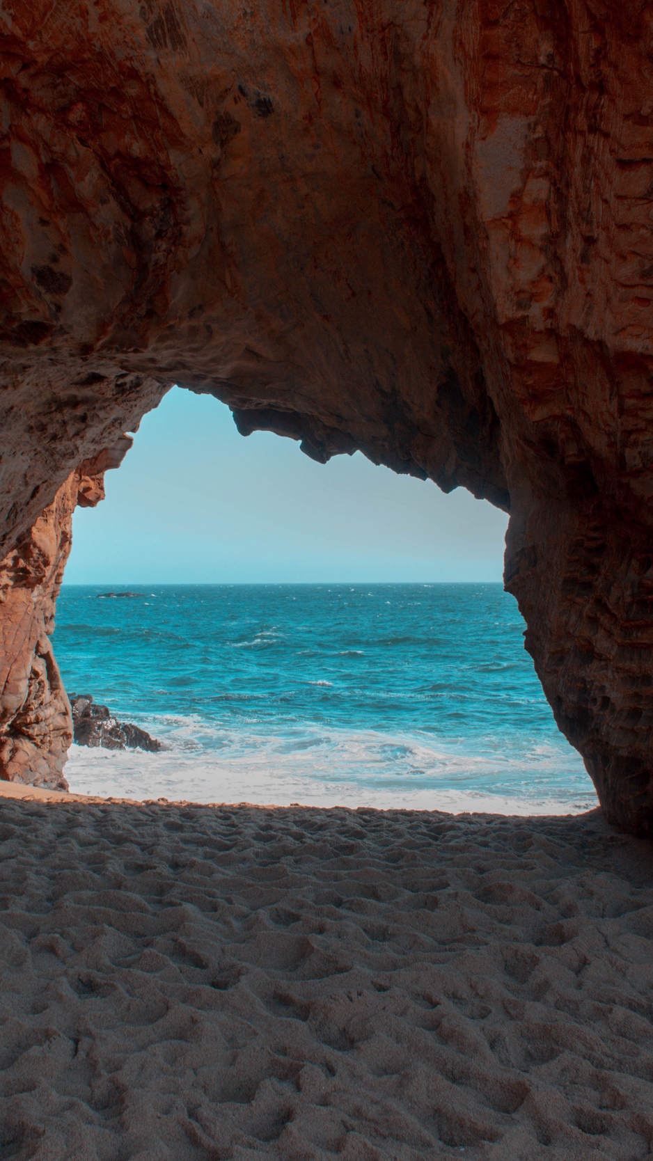 Download wallpaper 938x1668 beach, rock, cave, sea, sand, water iphone 8/7/6s/6 for 